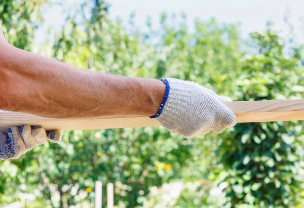 Caucasian Man Holding Planks Hands Bright Sky Sunny Day — Stock Photo, Image