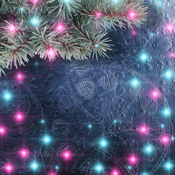 Branch of spruce with bright garlands and lights on beautiful abstract background