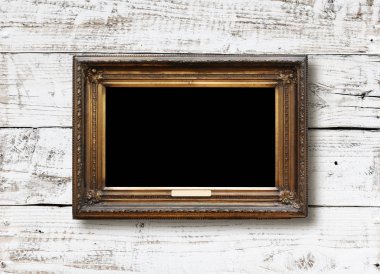 Eski vintage altın süslü çerçeve için grunge ahşap duvar resmi