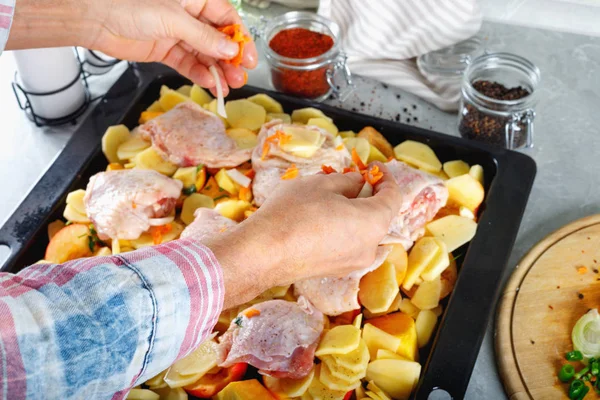 Hand of man take cooking of meat with vegetable and  spices for grill.  Cooking  kitchen ingredients on table.