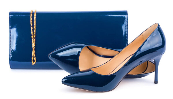 Beautiful  blue shoes with clutches on white isolated background