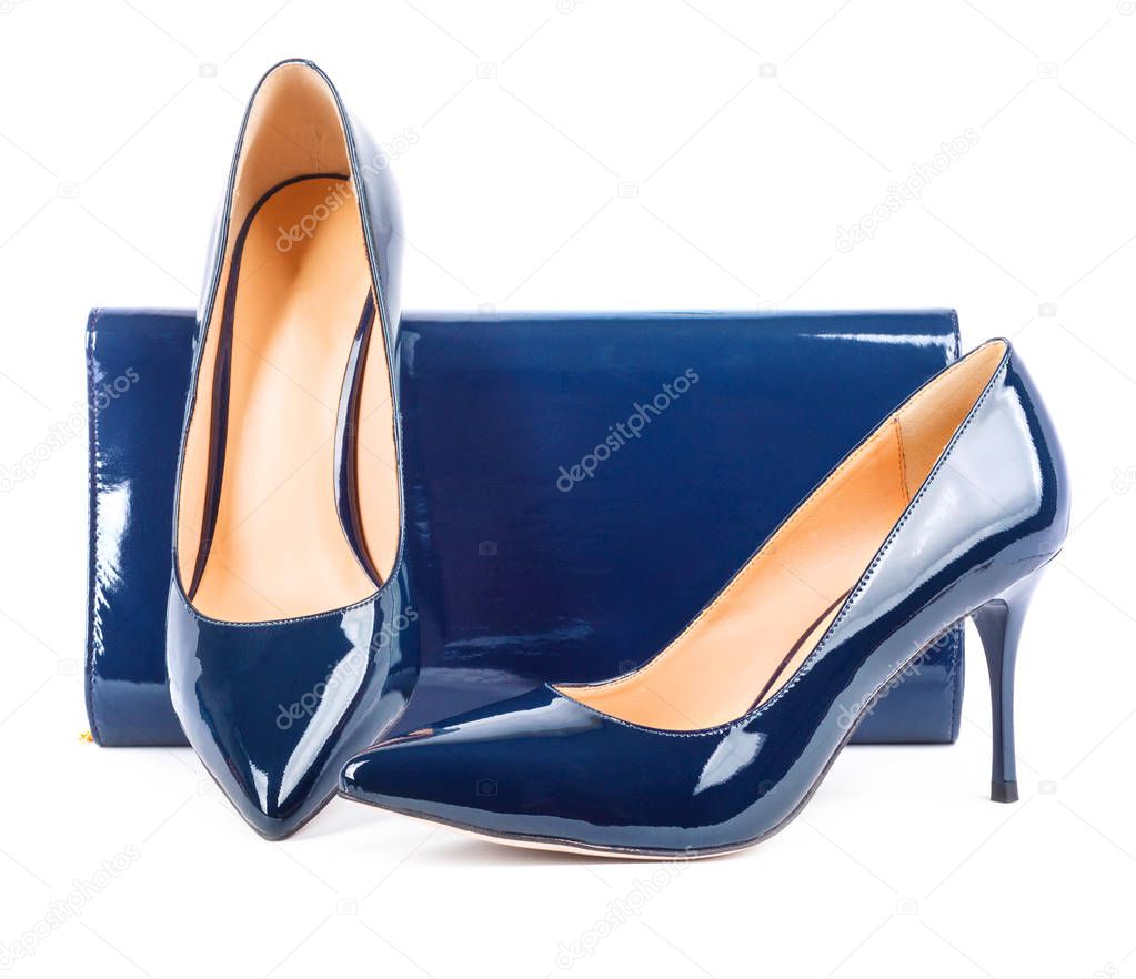 Beautiful  blue shoes with clutches on white isolated background