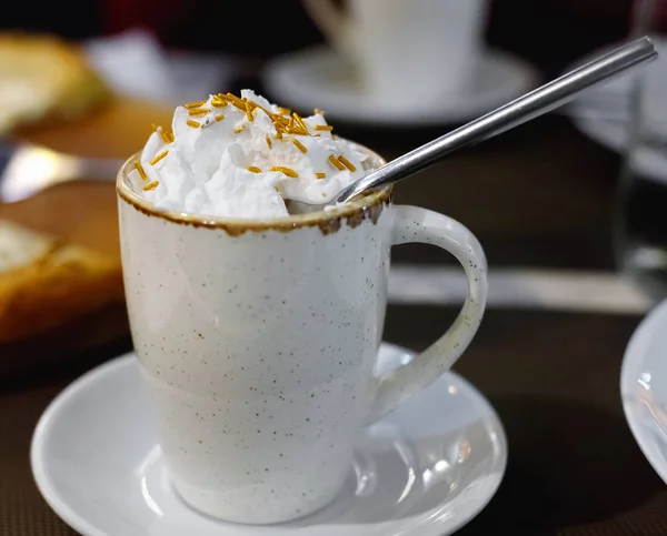 Cup of fresh caramel latte with whipped cream — Stock Photo, Image