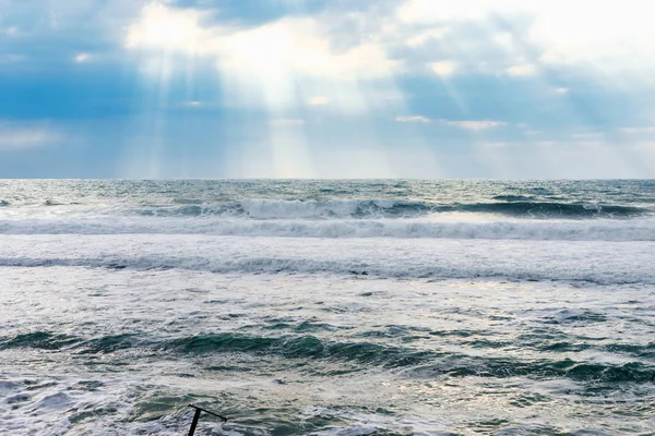 Big sea waves, big storm, weather elements on background of blue sky