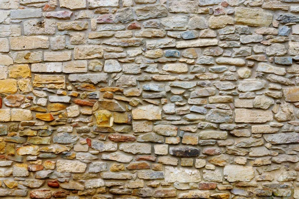 Texture collapsing stone wall of old house with brick masonry. — Stock Photo, Image