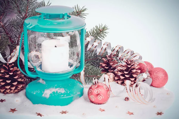 Snowy blue lantern and Christmas balls on the background of fir — Stock Photo, Image