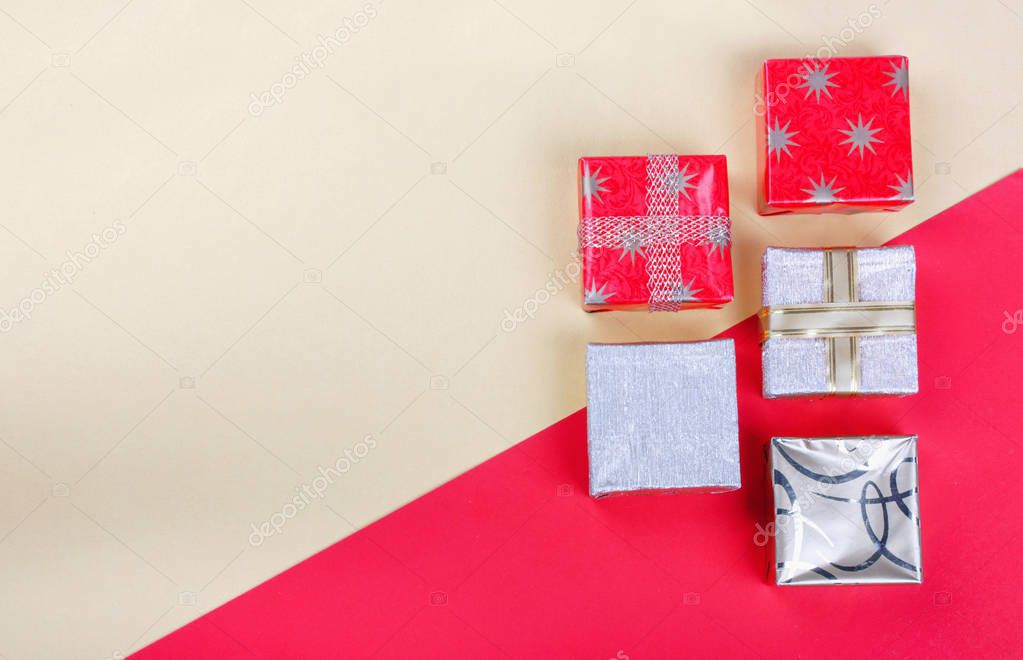 Golden gift box on red background.Top view flat lay group object