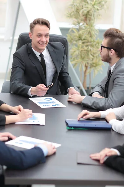 Businessman at a meeting with employees — Stock Photo, Image