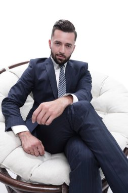 Bir sandalyede oturan başarılı iş adamı.