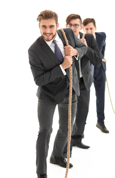 Closeup.sorrindo equipe de negócios puxa a corda . — Fotografia de Stock