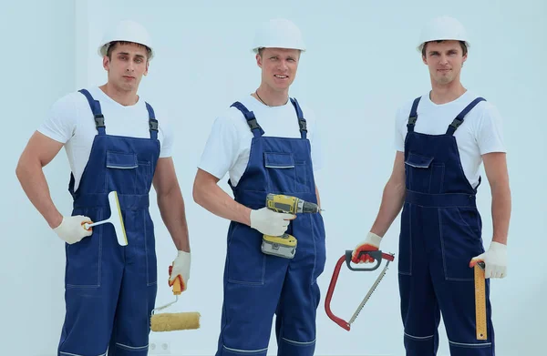 Team of construction workers with working tools — Stock Photo, Image