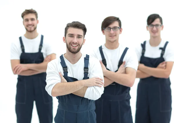 Happy team of responsible movers and their smiling leader. — Stock Photo, Image
