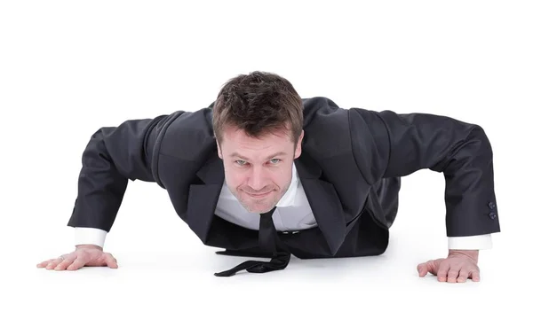 Young businessman being wrung out from a floor — Stock Photo, Image