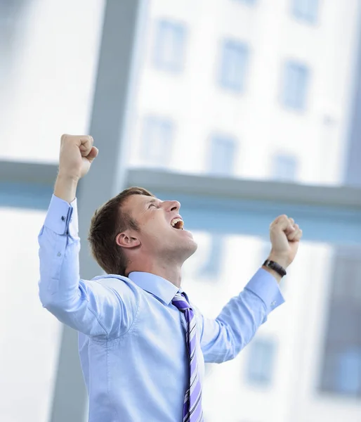 Businessman celebrating with his fists raised in the air — Stock Photo, Image