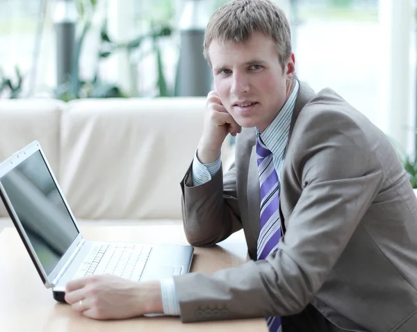 Young employee looking at computer monitor during working day — Stock Photo, Image
