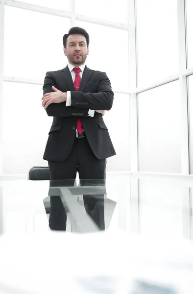 Serious businessman standing in the conference room — Stock Photo, Image