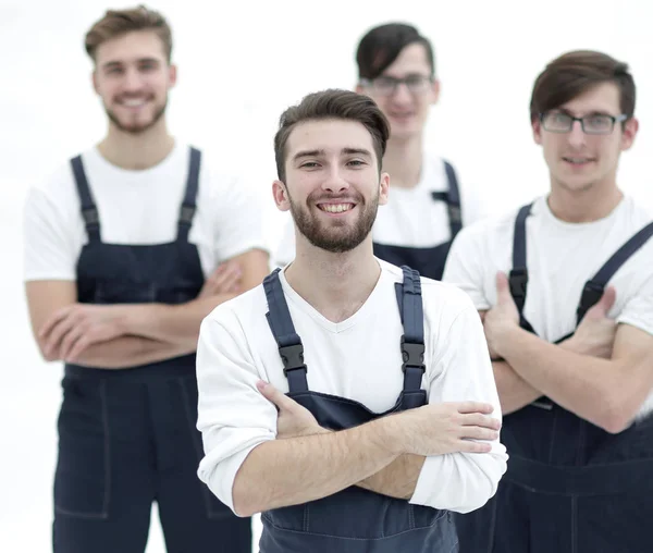 Happy team of responsible movers and their smiling leader. — Stock Photo, Image