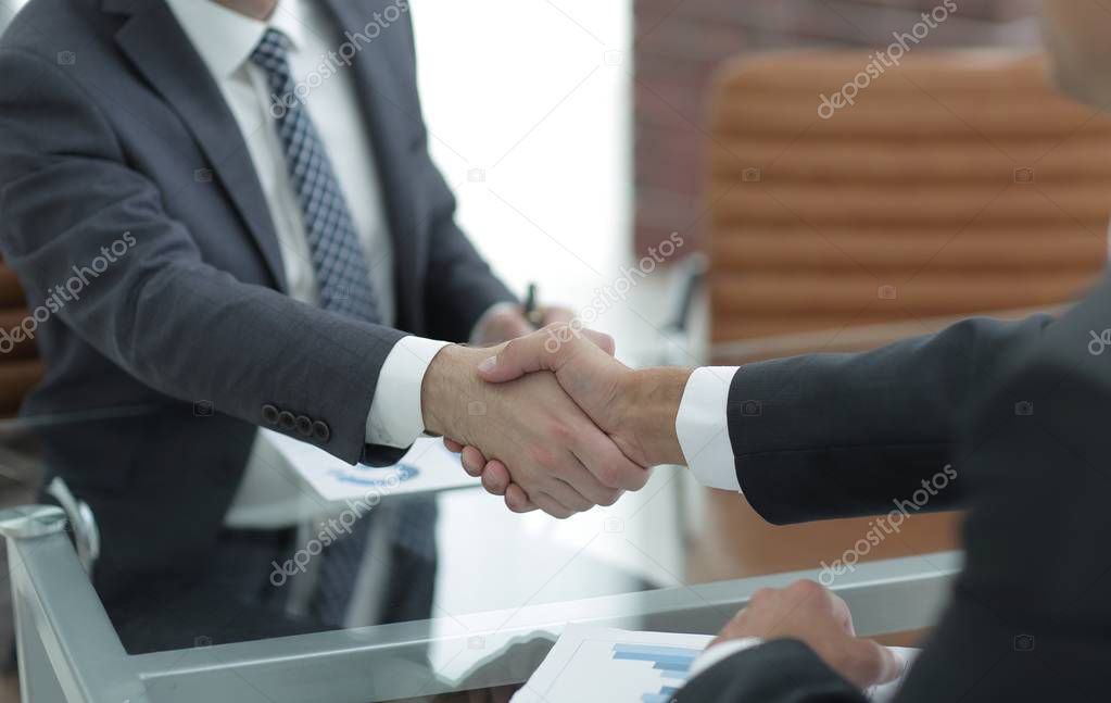 handshake of business partners on business negotiations