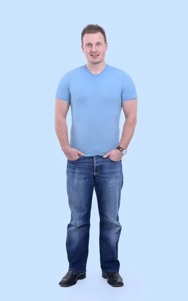 Full-sized portrait.the guy in jeans and a t-shirt. — Stock Photo, Image