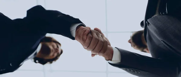 Two business people are holding hands to business cooperation. — Stock Photo, Image