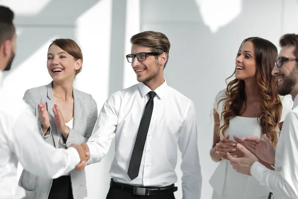 Business partners are stretching out their hands for a handshake — Stock Photo, Image