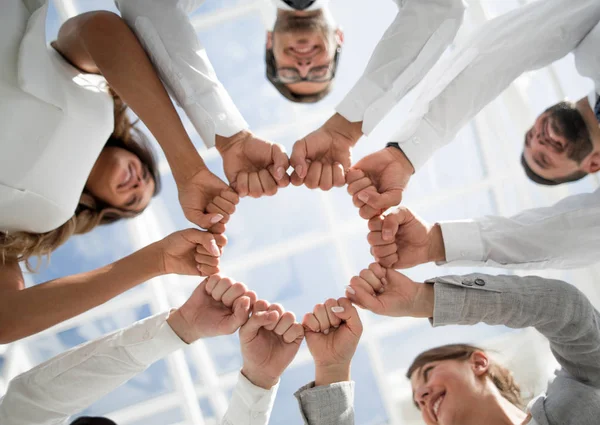 Bottom view. business team standing in a circle. — Stock Photo, Image