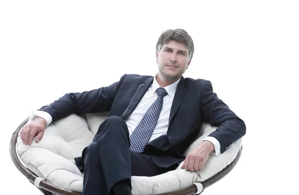 Tired business man sitting in a large comfortable chair — Stock Photo, Image