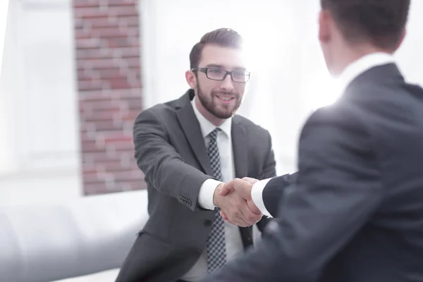 Two colleagues shaking hands after a business meeting — Stock Photo, Image