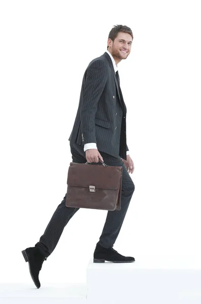 In full growth. a businessman with a leather briefcase walks up. — Stock Photo, Image