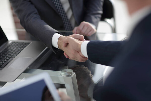 confident handshake of business partners