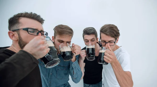 Close up. a group of successful young men drinking beer . — стоковое фото