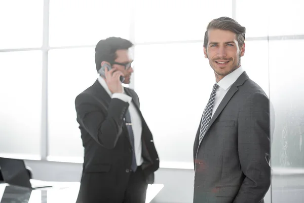 Business colleagues standing in the office — Stock Photo, Image