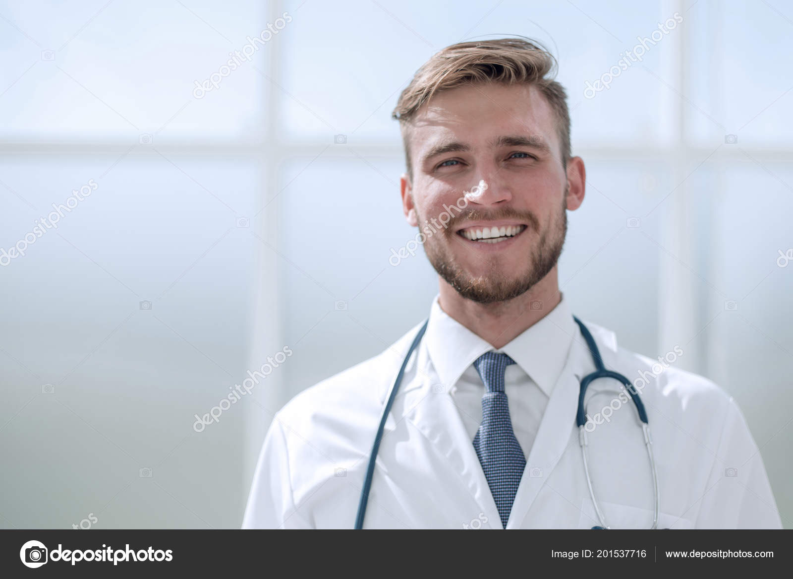 Successful doctor the therapist, standing near the window Stock Photo