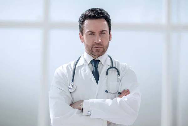 Portrait of serious doctor on blurred background — Stock Photo, Image