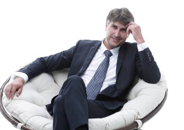 iş adamı büyük bir rahat sandalyede oturuyor. Gevşeme kavramı