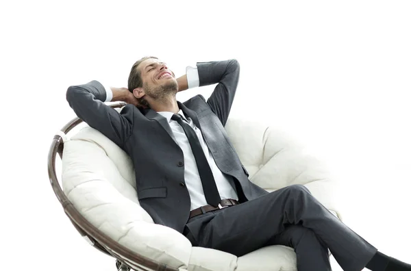 Joven hombre de negocios meditando en gran sillón cómodo — Foto de Stock