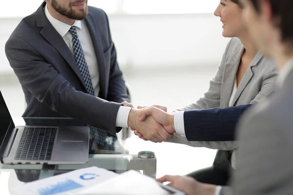 confident handshake of business partners