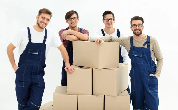 Men holding pile of carton boxes isolated on white background — Stock Photo, Image