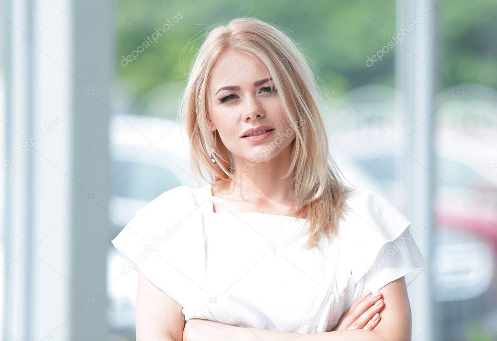 successful business woman standing in the spacious lobby of the office.