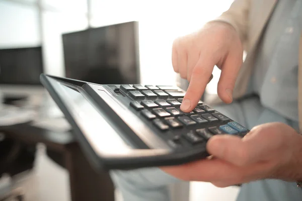 Close up. businessman using calculator — Stock Photo, Image