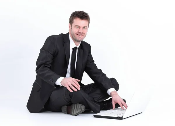 Hombre de negocios con portátil sentado en el suelo . —  Fotos de Stock