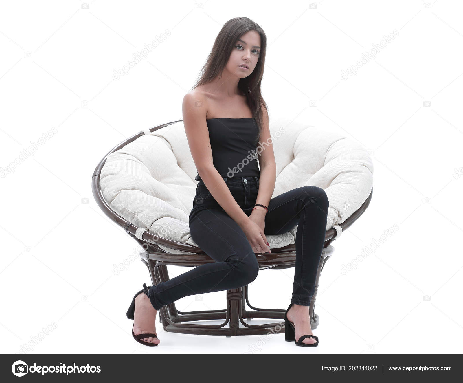 Young Business Woman Sitting In A Wide Round Chair Stock