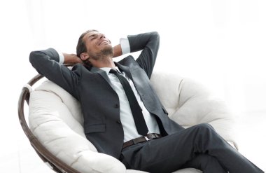 genç işadamı büyük rahat koltukta, meditasyon