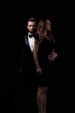 şık erkek ve kadın yan yana studio poz.