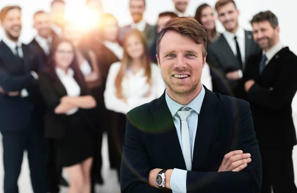 Businessman standing in front of a large business team. — Stock Photo, Image