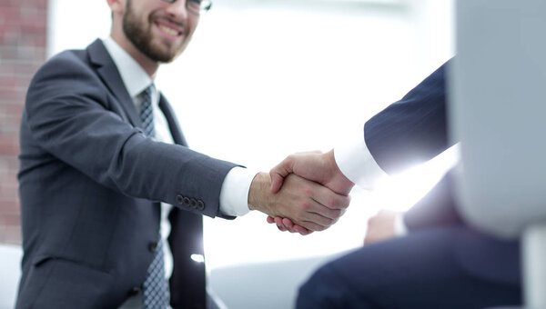 Close up of business handshake in the office