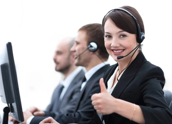 Manager of the call centre shows thumb up sitting at your Desk — Stock Photo, Image