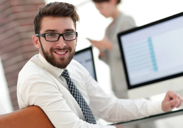 Experienced programmer sitting in front of the monitor. — Stock Photo, Image