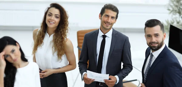 Employees standing in a modern office — Stock Photo, Image