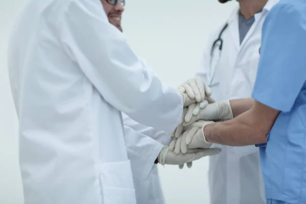 Group of doctors,clasped their hands together — Stock Photo, Image